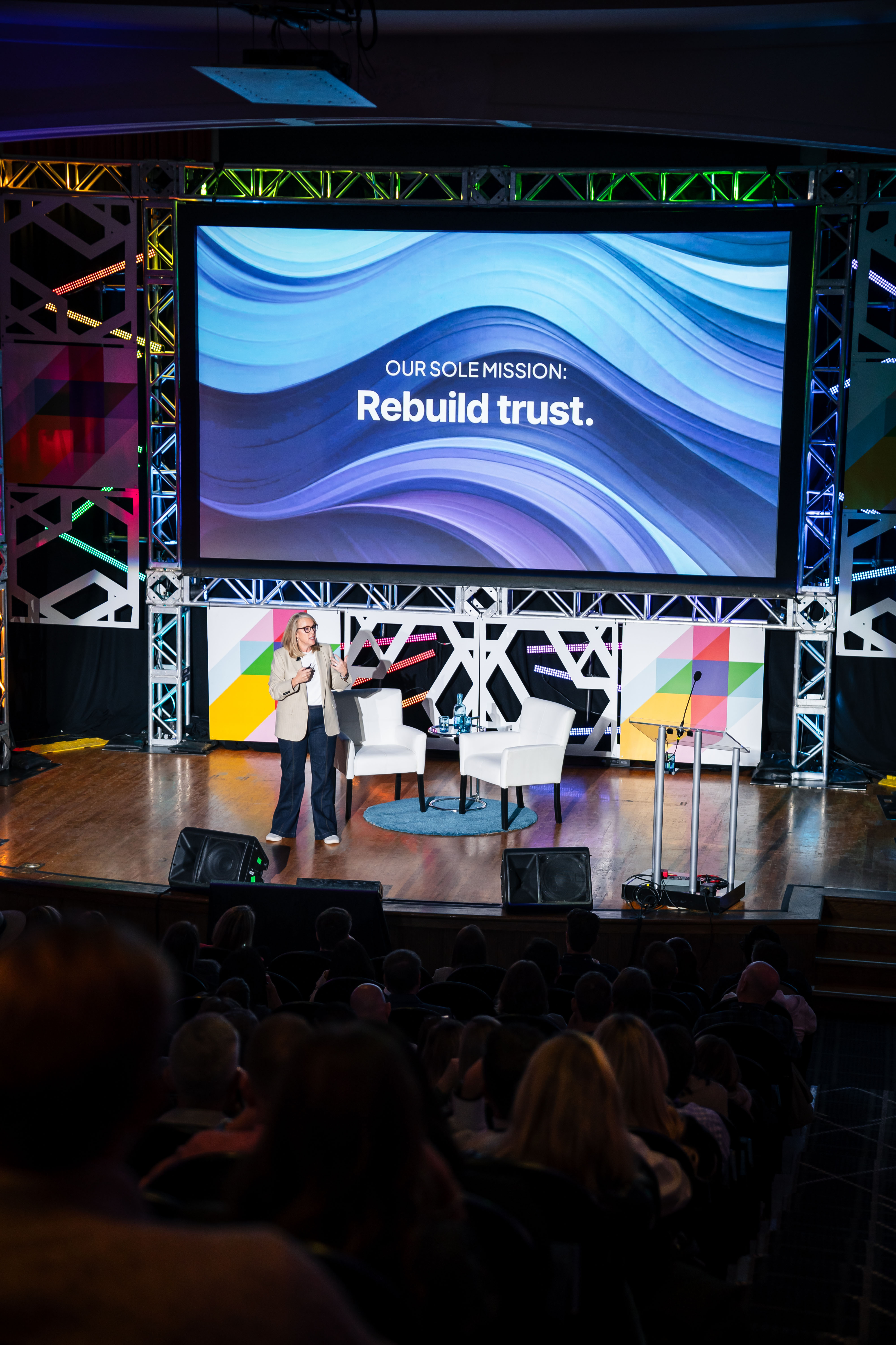 Our sole mission is to rebuild trust backdrop on stage with a speaker