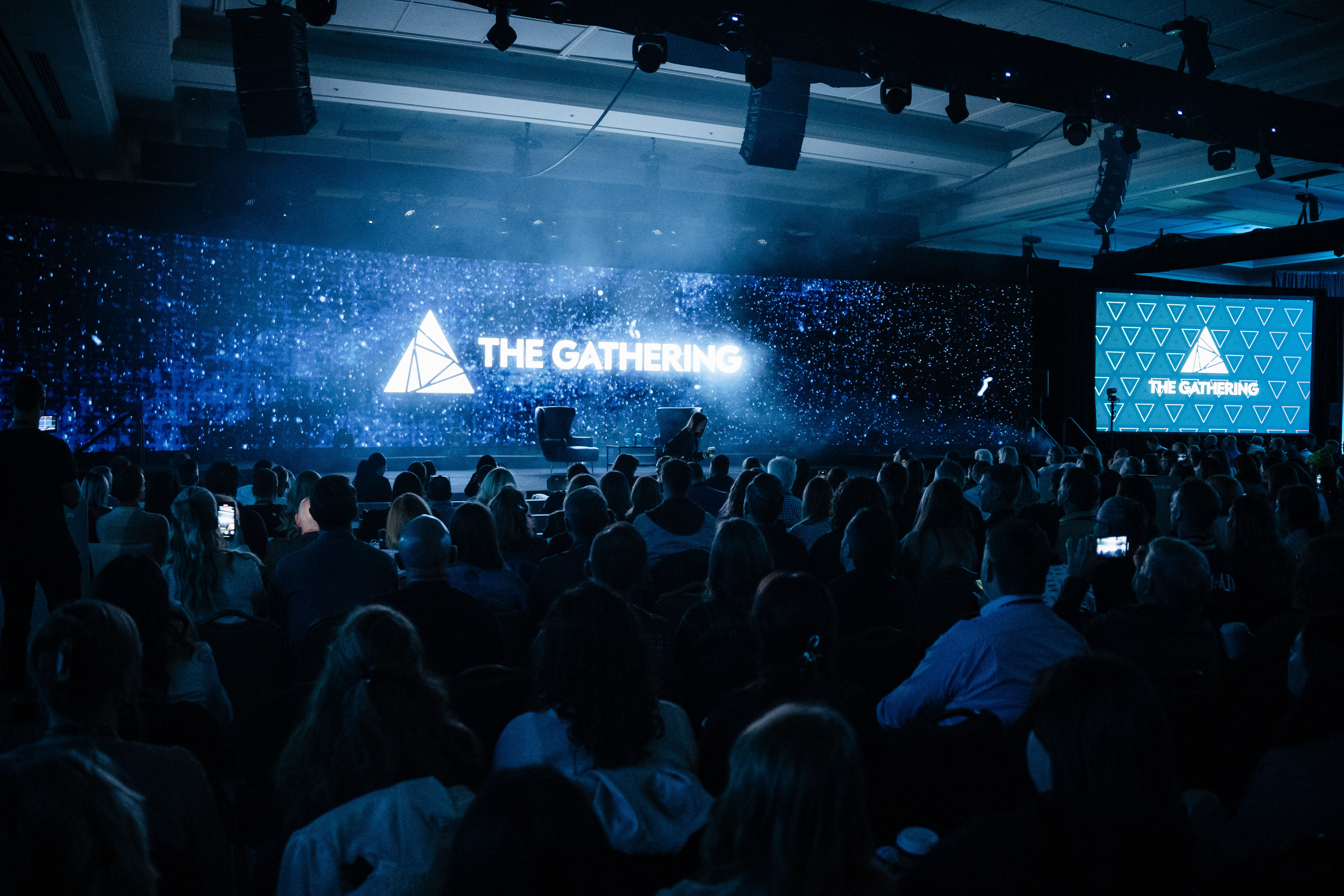 starry lights heighting the logo and name the gathering.